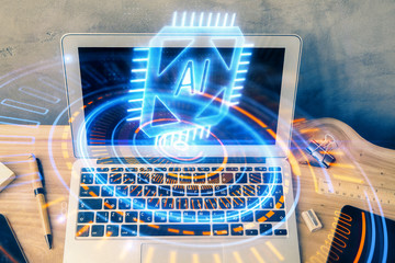 Double exposure of desktop computer and technology theme hologram. Concept of software development.