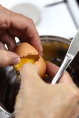 Cracking egg into melted chocolate. Making Chocolate, Pear and Pecan Pie Series.