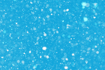 Flying dust particles on a blue background