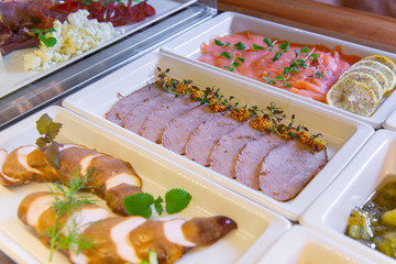 Restaurant breakfast menu with various cakes.