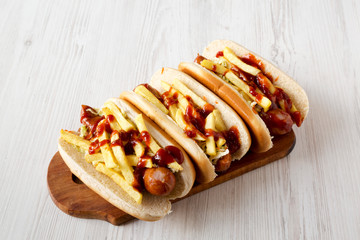 Homemade Cleveland Polish Boy Sandwich on a rustic wooden board on a white wooden background, low angle view. Close-up.