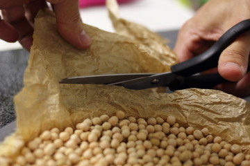 Trim excess of baking parchment. Making Chocolate, Pear and Pecan Pie Series.
