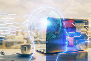 Multi exposure of work table with computer and brain hologram. Brainstorm concept.