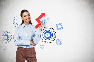Smiling woman with graph, gears as team