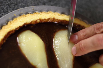 Making lengthways cuts all along each pear. Making Chocolate, Pear and Pecan Pie Series.