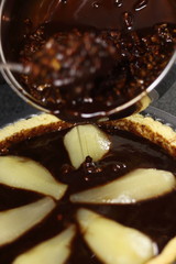 Pouring pecan mixture over top. Making Chocolate, Pear and Pecan Pie Series.