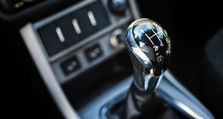 Gear lever. Manual Transmission. Hand on the gear shift in the car.