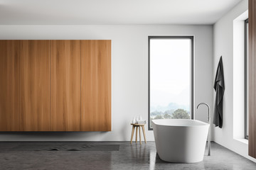 White bathroom interior with cabinet, side view