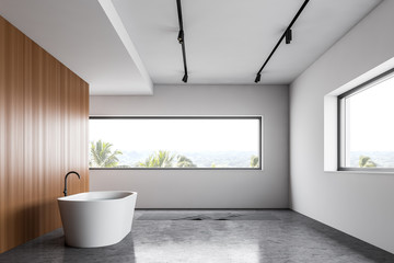 Obraz na płótnie Canvas White and wooden loft bathroom interior with tub