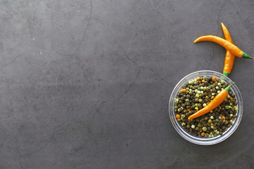 Hot orange pepper. Chilean pepper on a black.