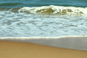 Soft wave of blue ocean on sandy beach.Summer beach and sea