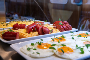 Restaurant breakfast menu with various cakes.