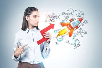 Woman pointing at graph and her start up idea