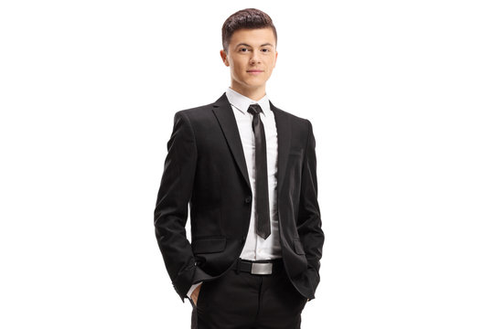 Young man in a suit posing with his hands in pocket