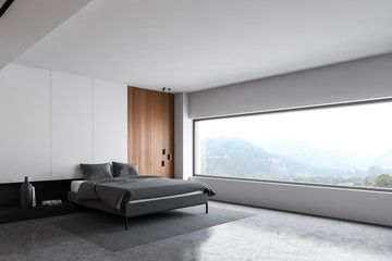 White and wooden master bedroom corner