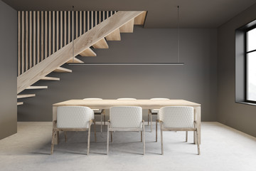 Gray dining room interior with stairs