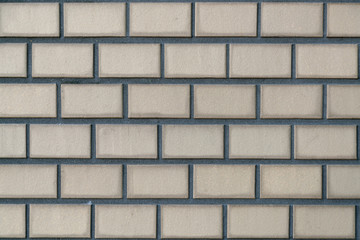 Cream brick wall pattern block background and texture