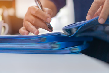 Signing document legal prepare paperwork or report for analysis information in TAX time on file...