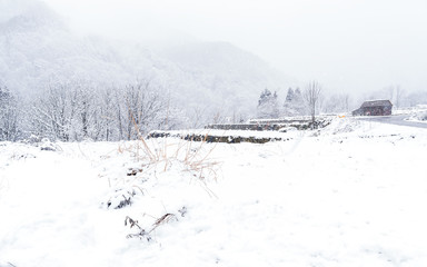 House of View Shirakawago villages winter on white snowfall landscape. Famous sightseeing location in Shirakawa-go gassho-zukuri,Gifu Chubu Japan. Landscape Mountain hill of beautiful place for travel