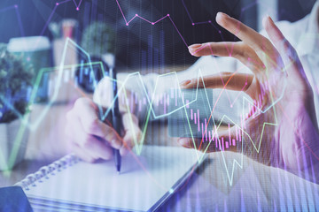 Forex chart displayed on woman's hand taking notes background. Concept of research. Multi exposure