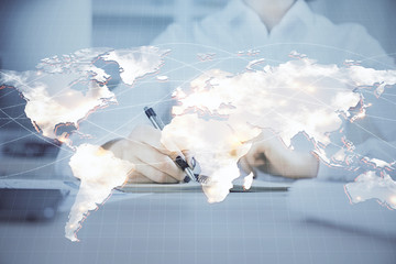 International business hud over woman's hands writing background. Concept of hard work. Double...