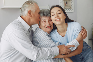 Couple in a room. Grandparents sitting at home.