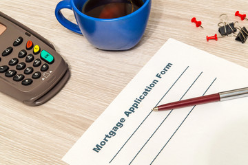 Mortgage agreement form blank is prepared for filling on table