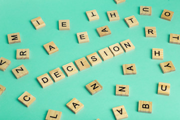 Search for decision concept. The word Decision composed of heaps of different letters on a green background