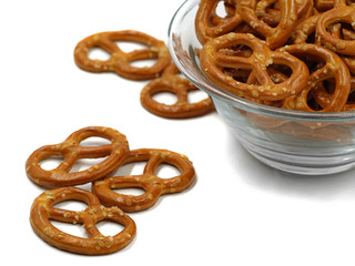 mini pretzels with salt in bowl isolated on white background