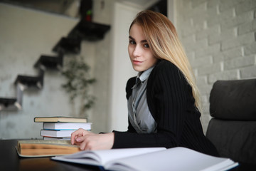 Young pretty blonde girl student
