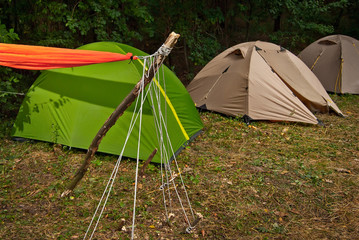 Camping tent. Orange hammock stretched between tents.
