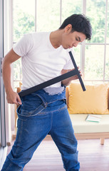 A man is making furniture assembly