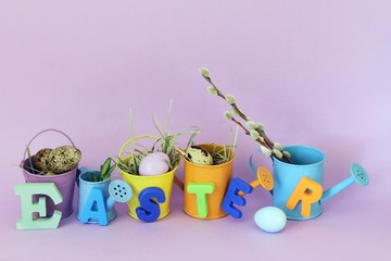  The word Easter from volume letters on toy garden supplies on a bright background, the concept of congratulations, interior decoration for the holiday