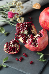 half pomegranate on a dark background
