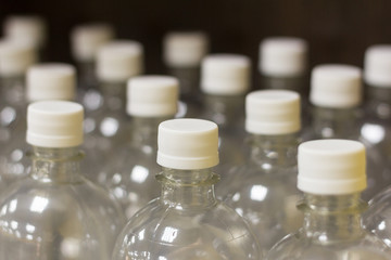 New plastic bottles with lids for filling water and beverages