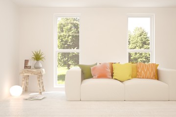 Stylish room in white color with sofa and summer landscape in window. Scandinavian interior design. 3D illustration