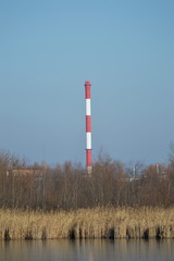 industrial chimney at the lake
