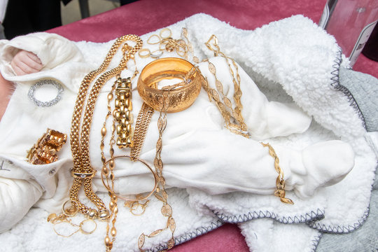 Pidyon Haben ceremony. Jewish ceremony firstborn baby 30 days old.Gold jewelry on a baby.