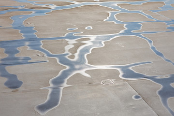 Membrane roofing. Drawing water on the roof of the membrane. Conceptual.