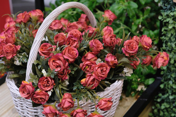 bouquet of red roses in a basket