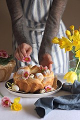 Easter wreath. Osterkranz. Germany traditional Easter cake decorated with quail eggs and fresh flowers.