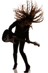 Woman playing on guitar and dancing