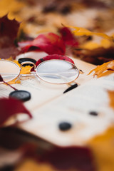glasses lying on the book