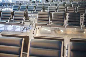 The waiting room at the airport with empty seats. Deserted hall of the airport