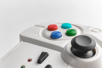 White wireless gamepad for playing video games. Joystick on a white background. Game controller...