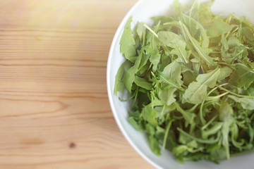 fresh green salad in a bowl, arugula