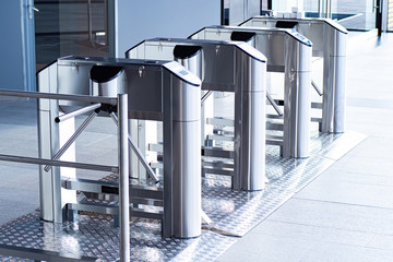 Entrance with turntables. A checkpoint with a turnstile. Turnstile with card reader. Electronic...