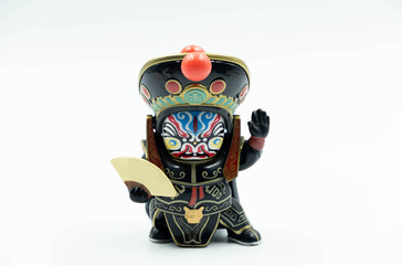 The  Sichuan Chengdu China Opera Mask Changing Doll with the colorful mask and Costume isolated on White Background