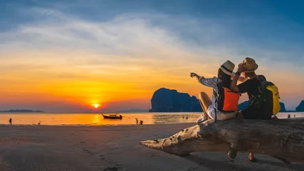 Foto op Canvas Romantic couple traveler joy look beautiful nature at sunset Pak Meng beach Outdoor lifestyle attraction travel Trang Thailand exotic beach Tourist on summer holiday vacation, Tourism destination Asia © day2505