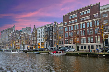 Fototapeta premium City scenic from Amsterdam in the Netherlands at sunset